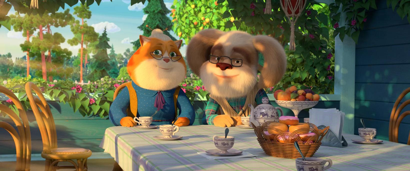 a couple of people in clothing sitting at a table with food