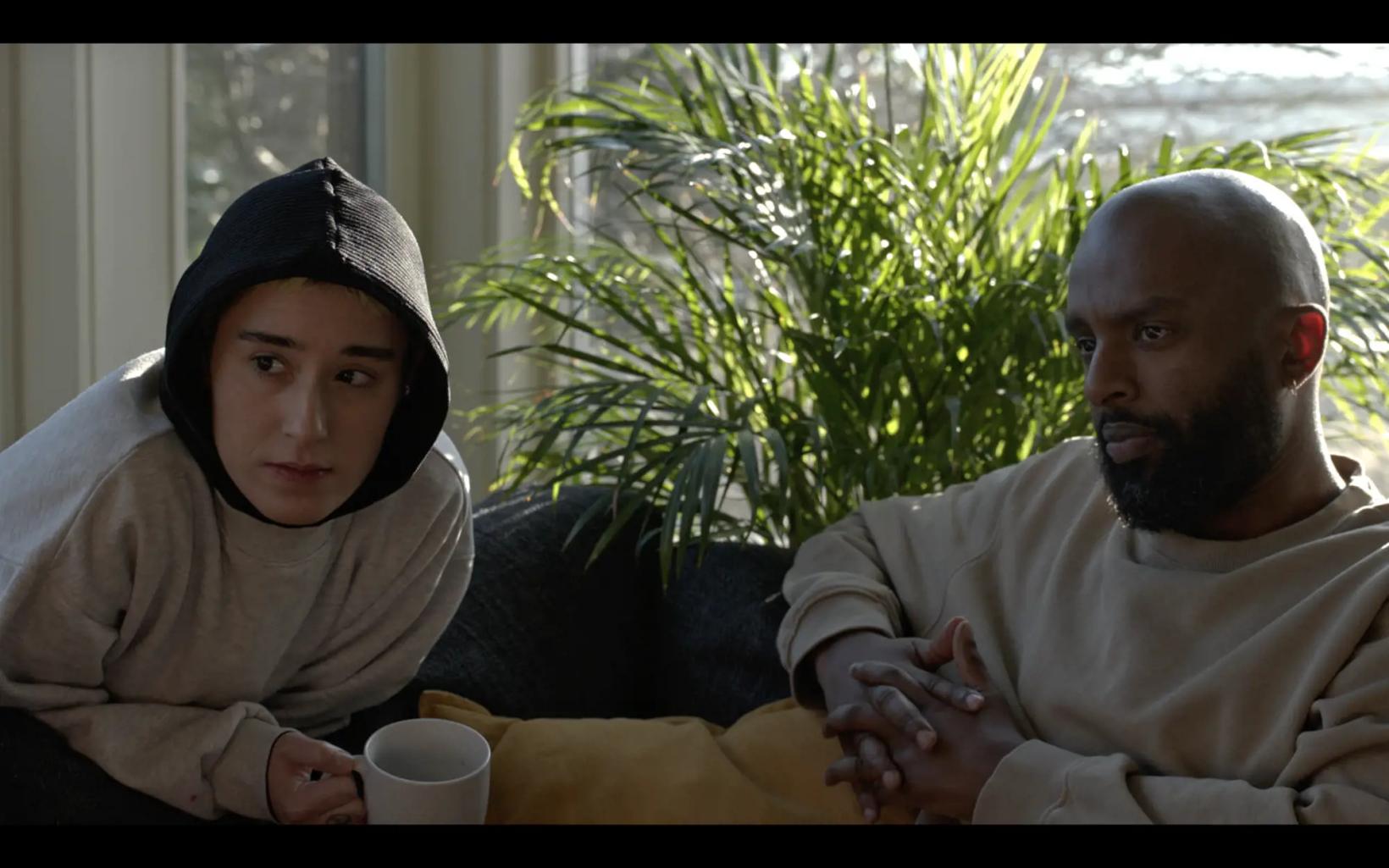 a man and a woman sitting on a couch