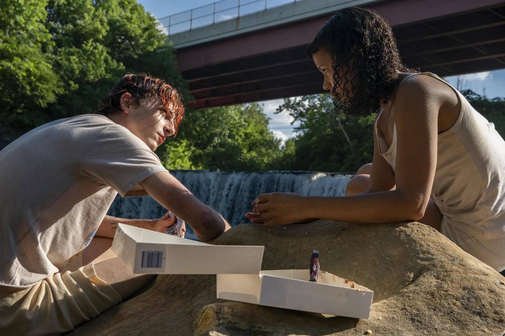 a man and woman working on a sculpture