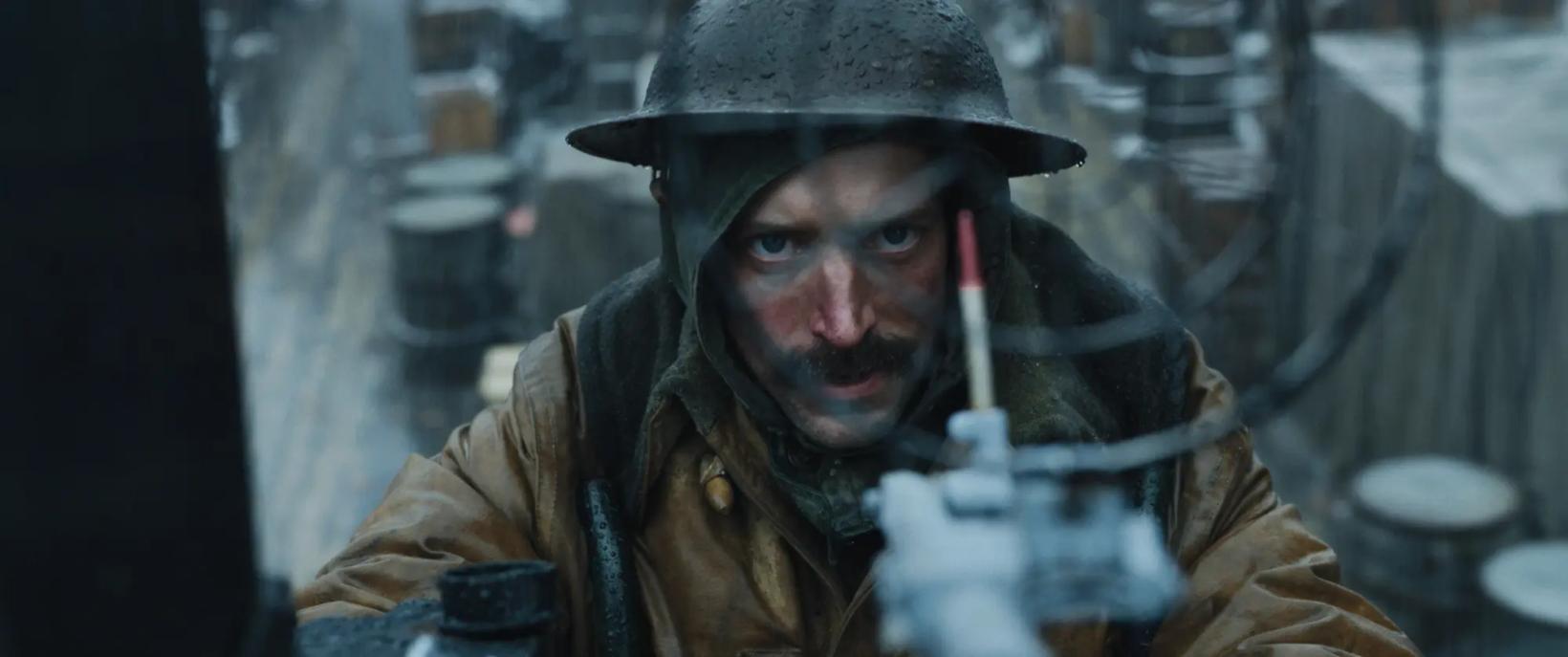 a man wearing a helmet and holding a gun