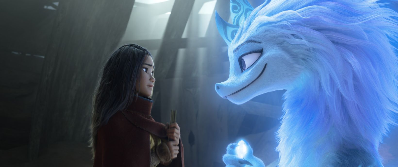 a person standing in front of a blue cartoon character