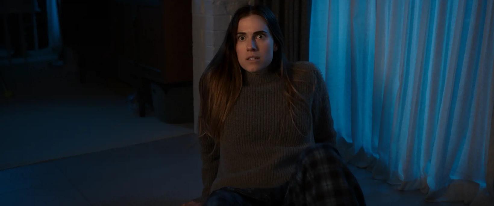 Allison Williams sitting on the floor