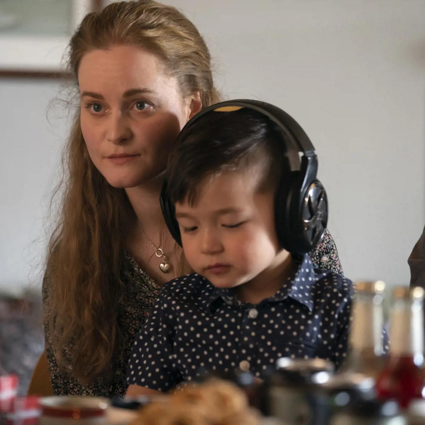 a woman and a child wearing headphones