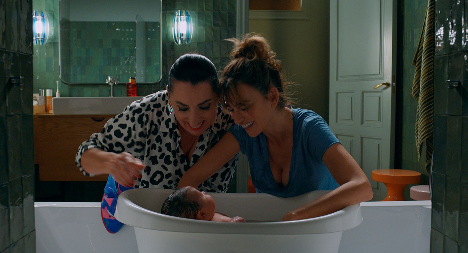 a person washing a baby