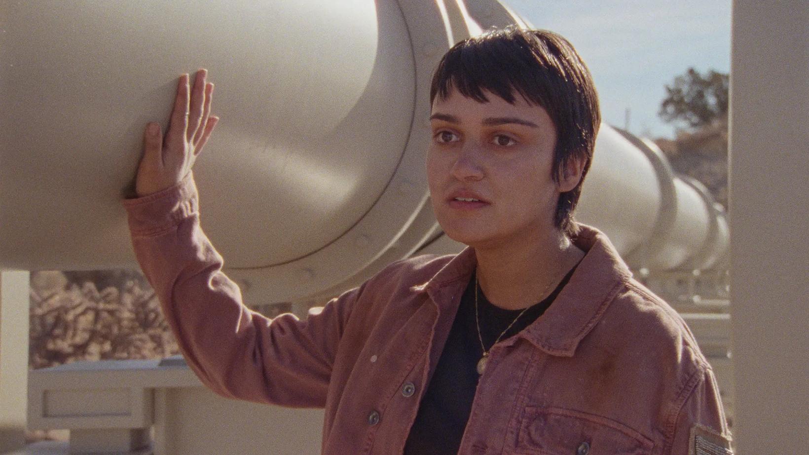 Ariela Barer holding up his hand