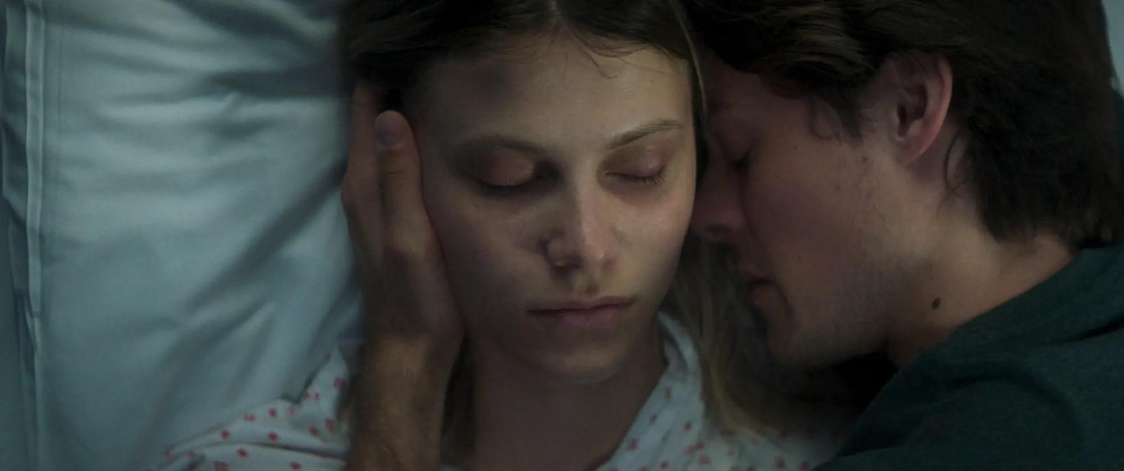 a man and woman kissing