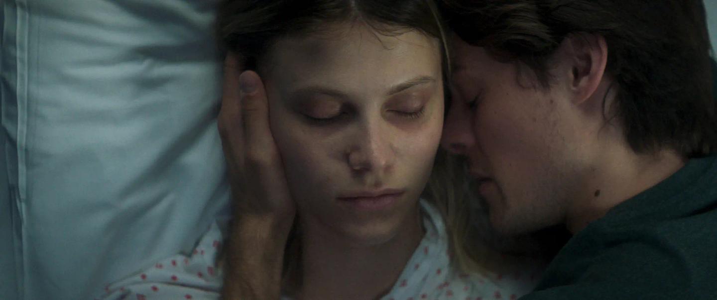 a man and woman kissing