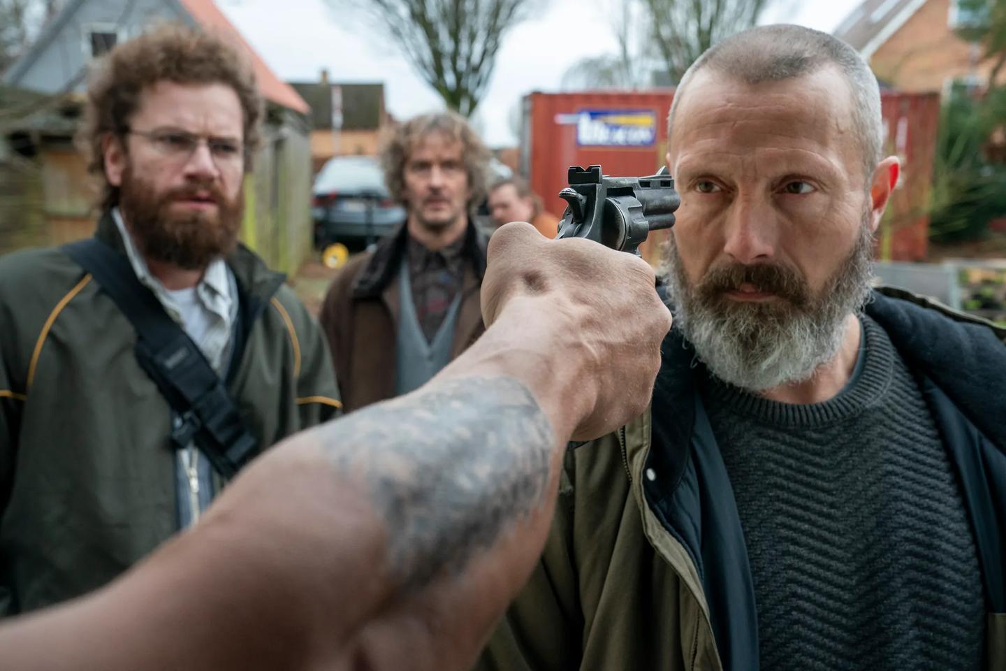 Nikolaj Lie Kaas holding a camera up to his face