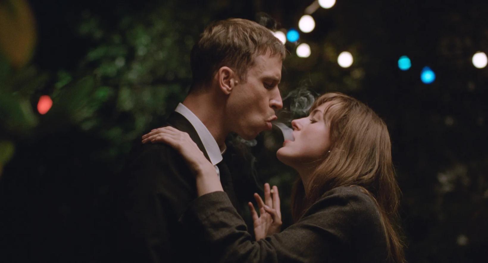 a man and woman kissing