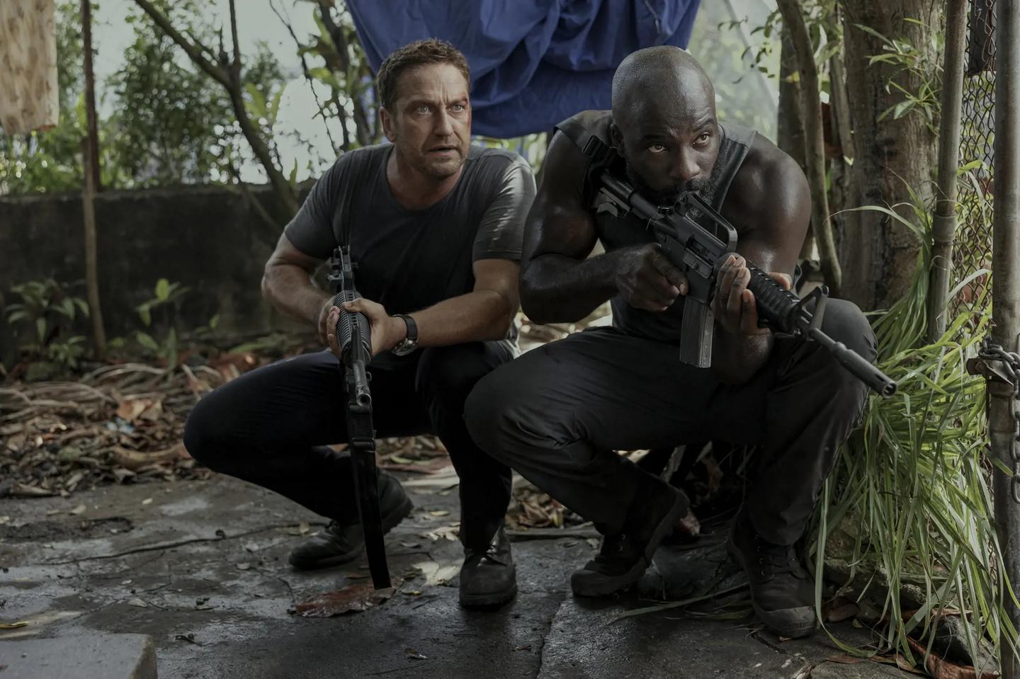 two men holding guns