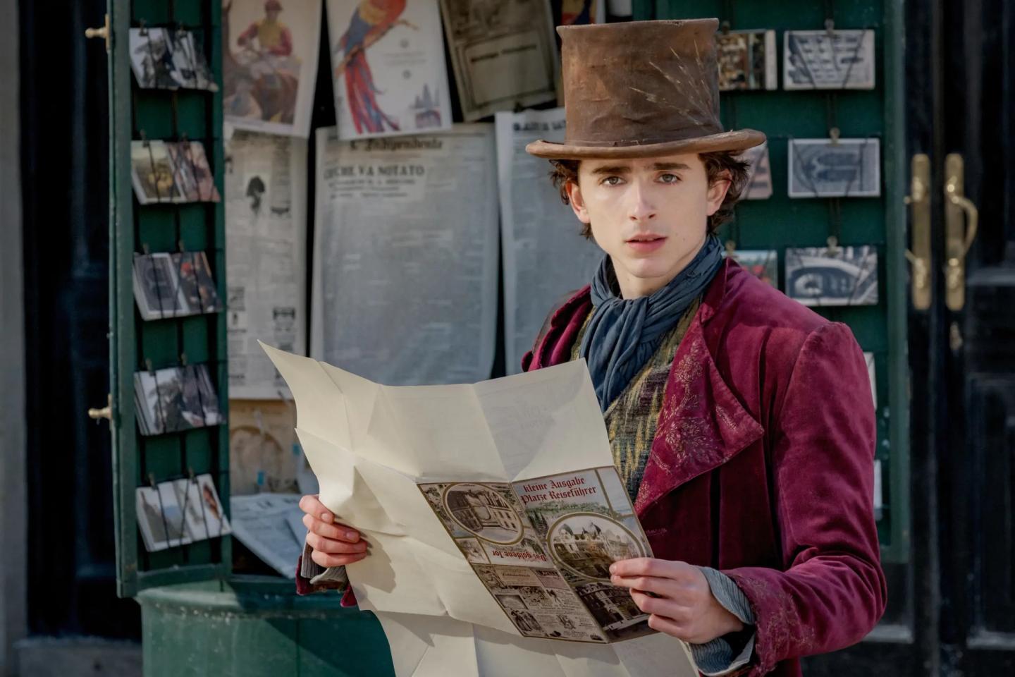 Timothée Chalamet holding a box