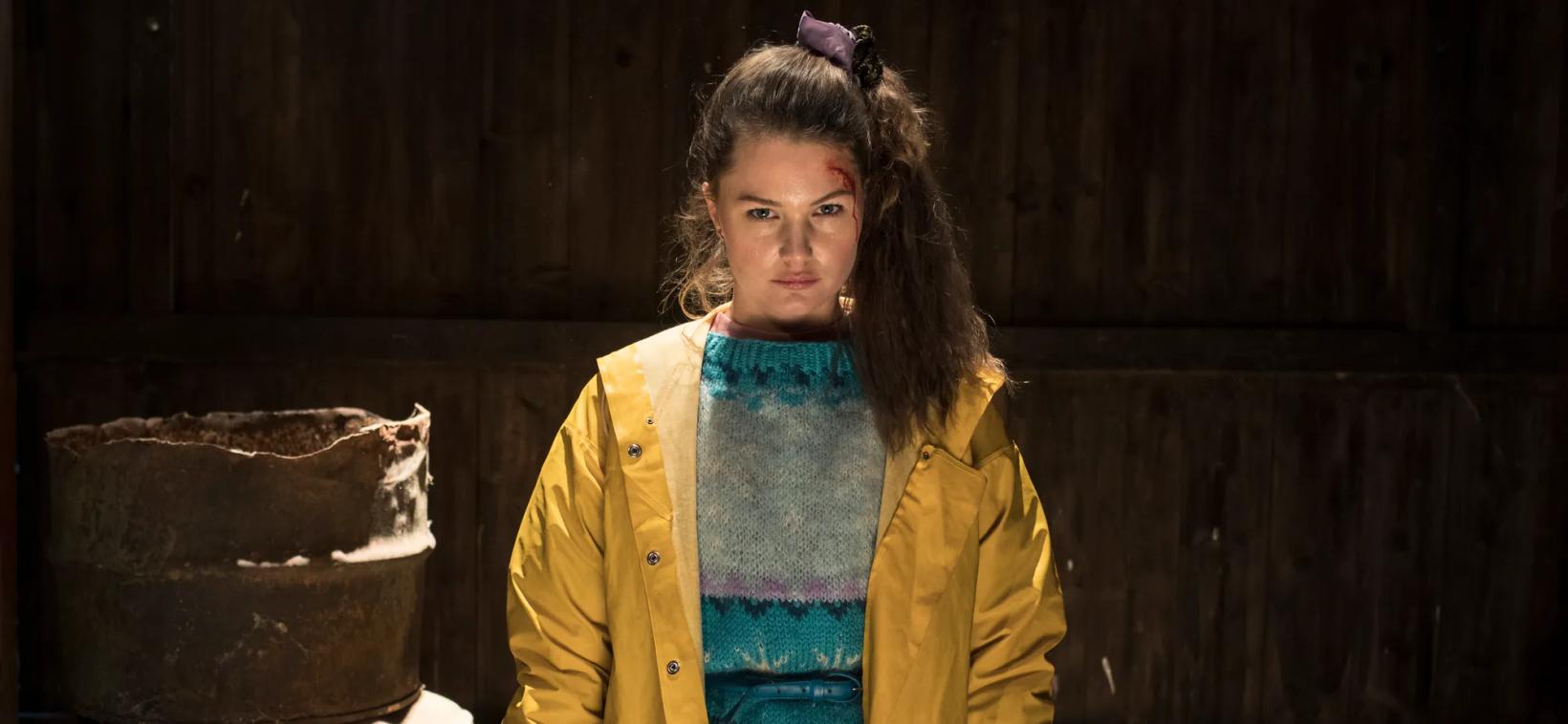 a person in a yellow jacket