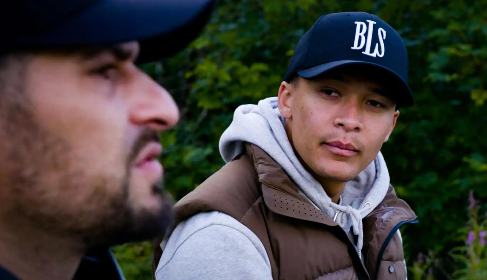 a man with a hat and a man with a beard