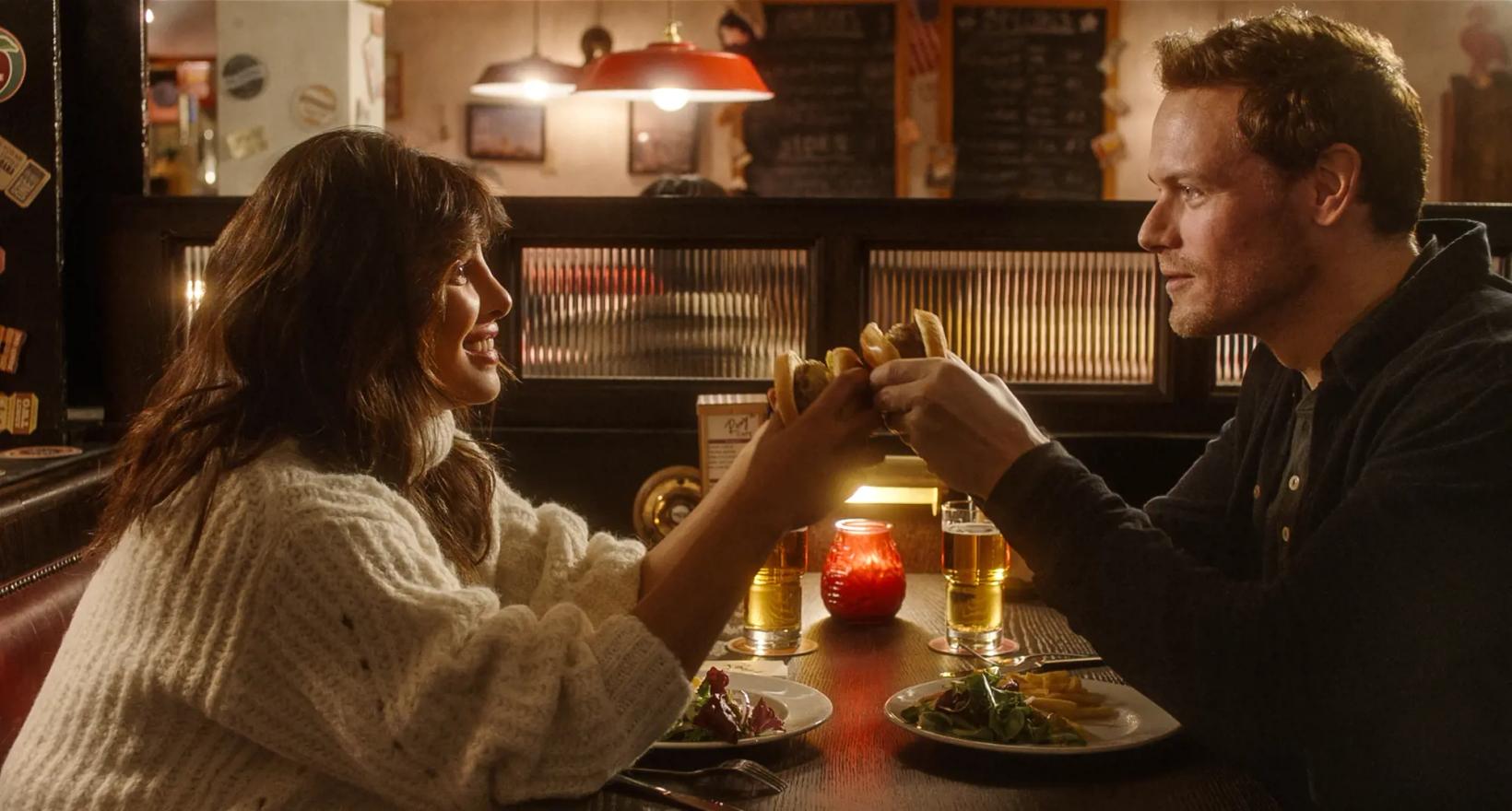 a man and a woman eating at a restaurant