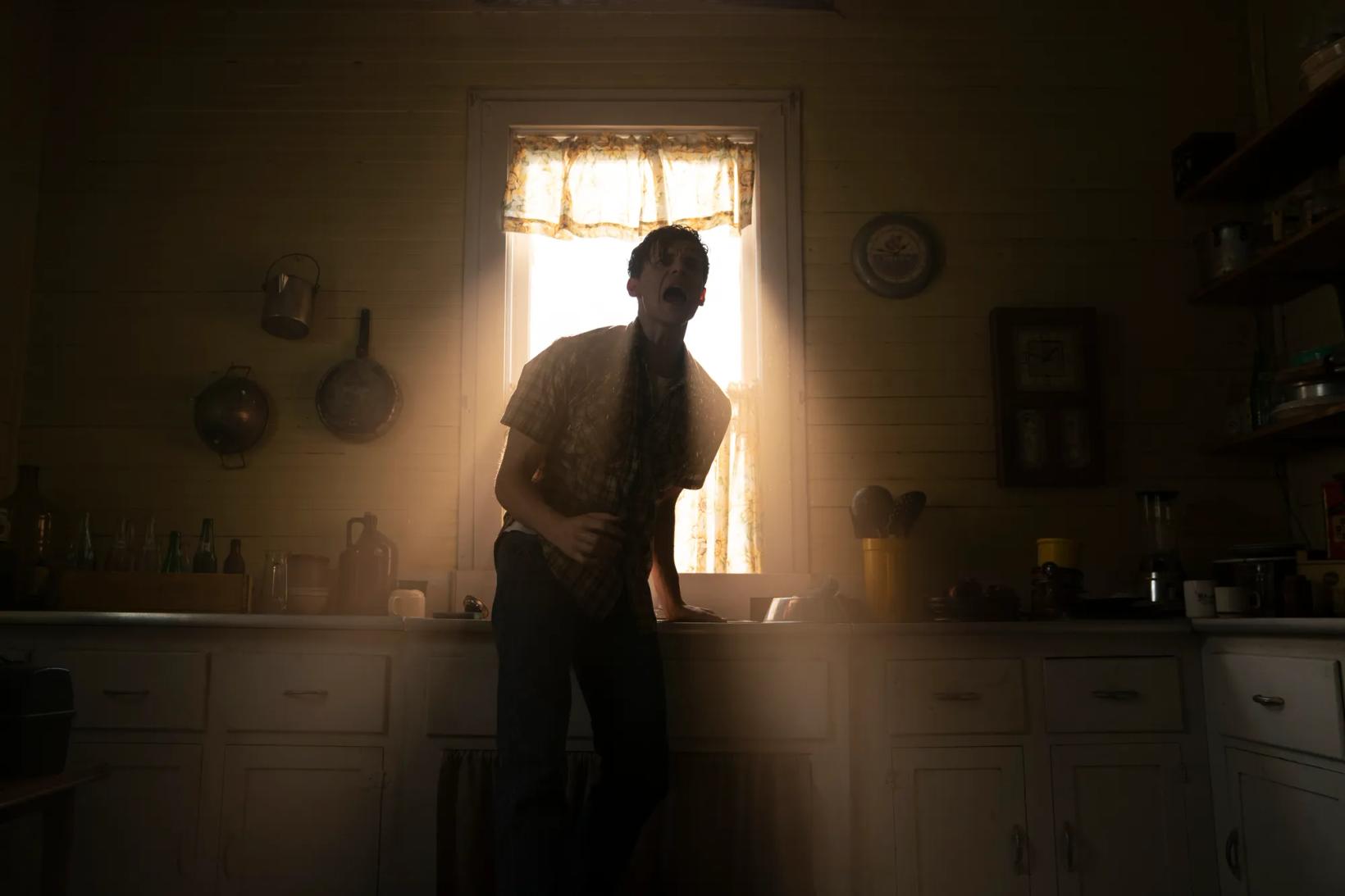 a man standing in a kitchen