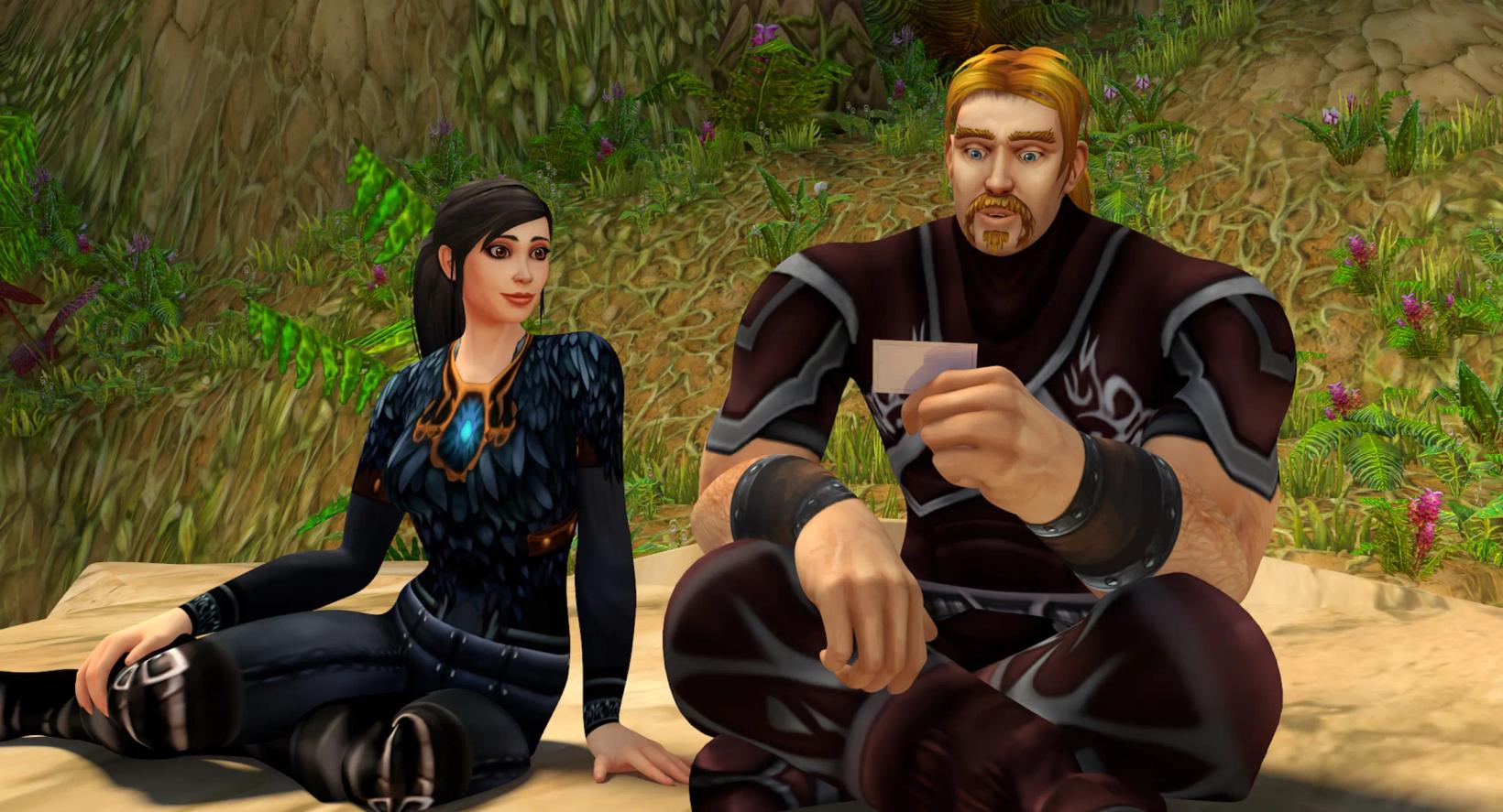 a man and woman sitting on the ground