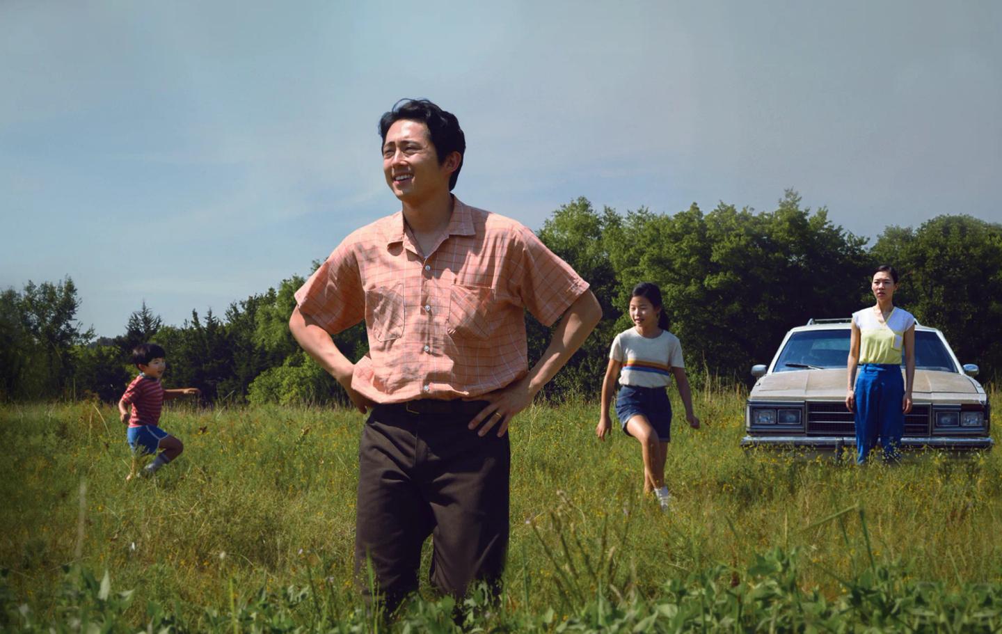 Steven Yeun et al. running in a field