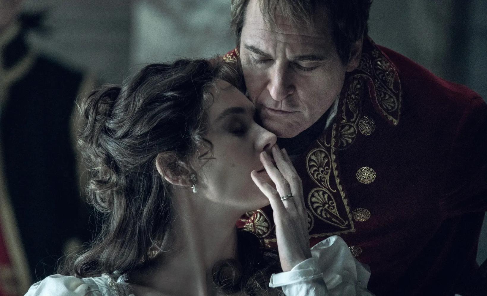 a man kissing a woman