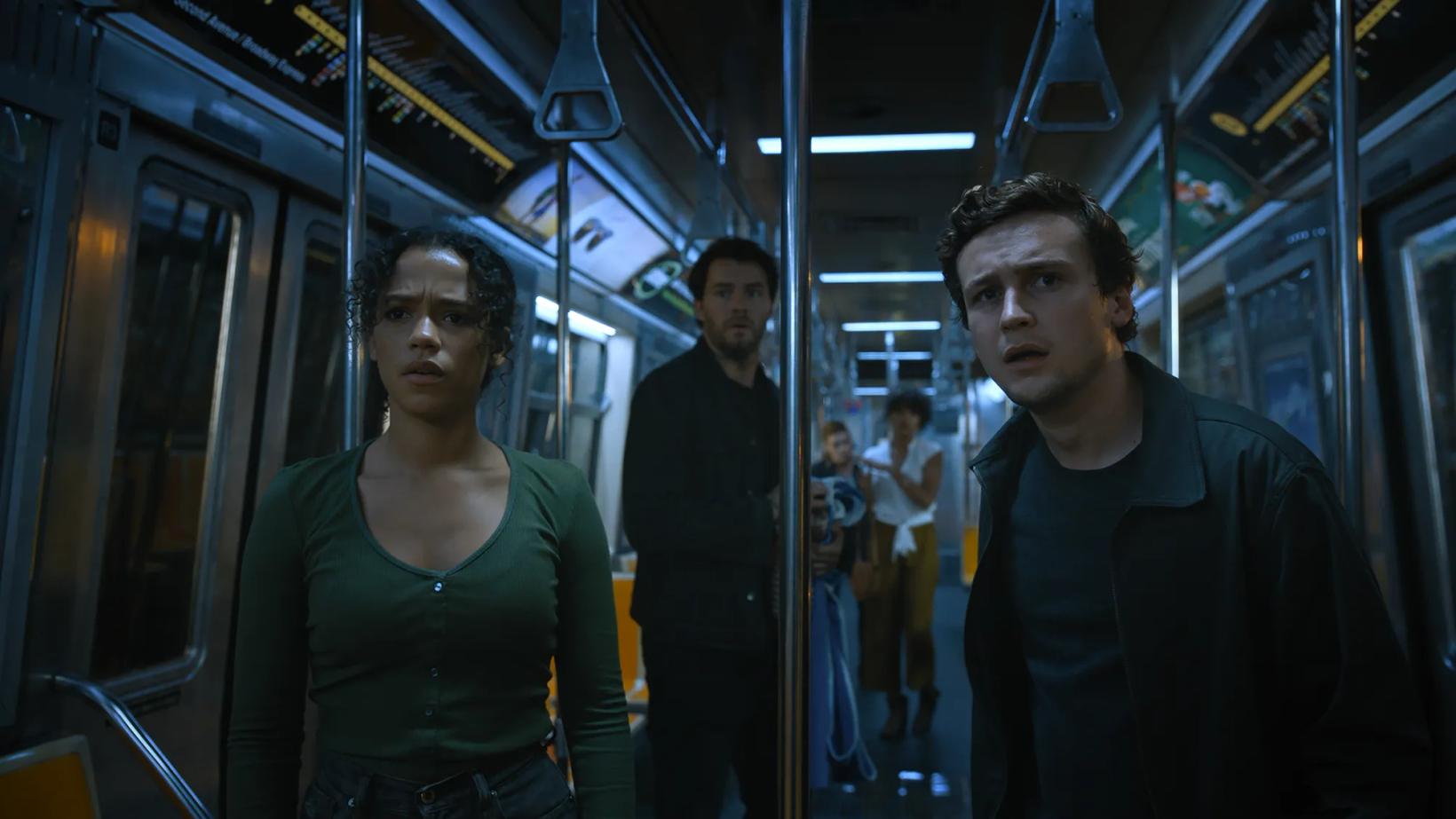 Logan Miller and woman on a subway