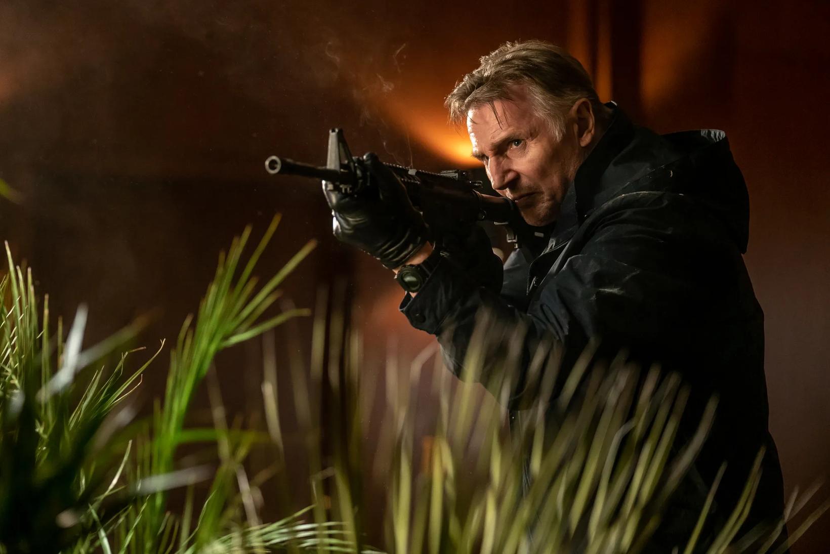 a man holding a gun
