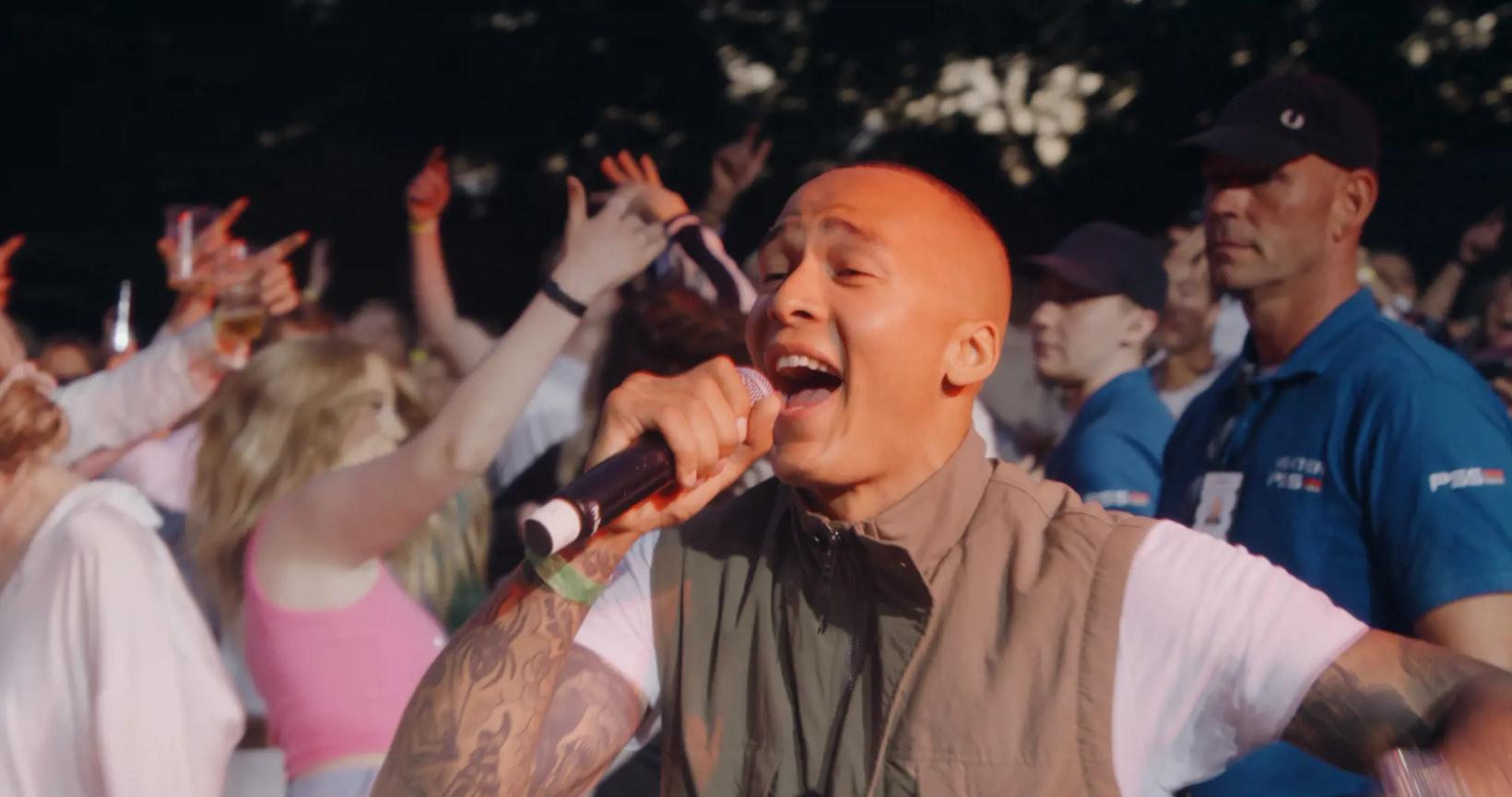 a person singing into a microphone