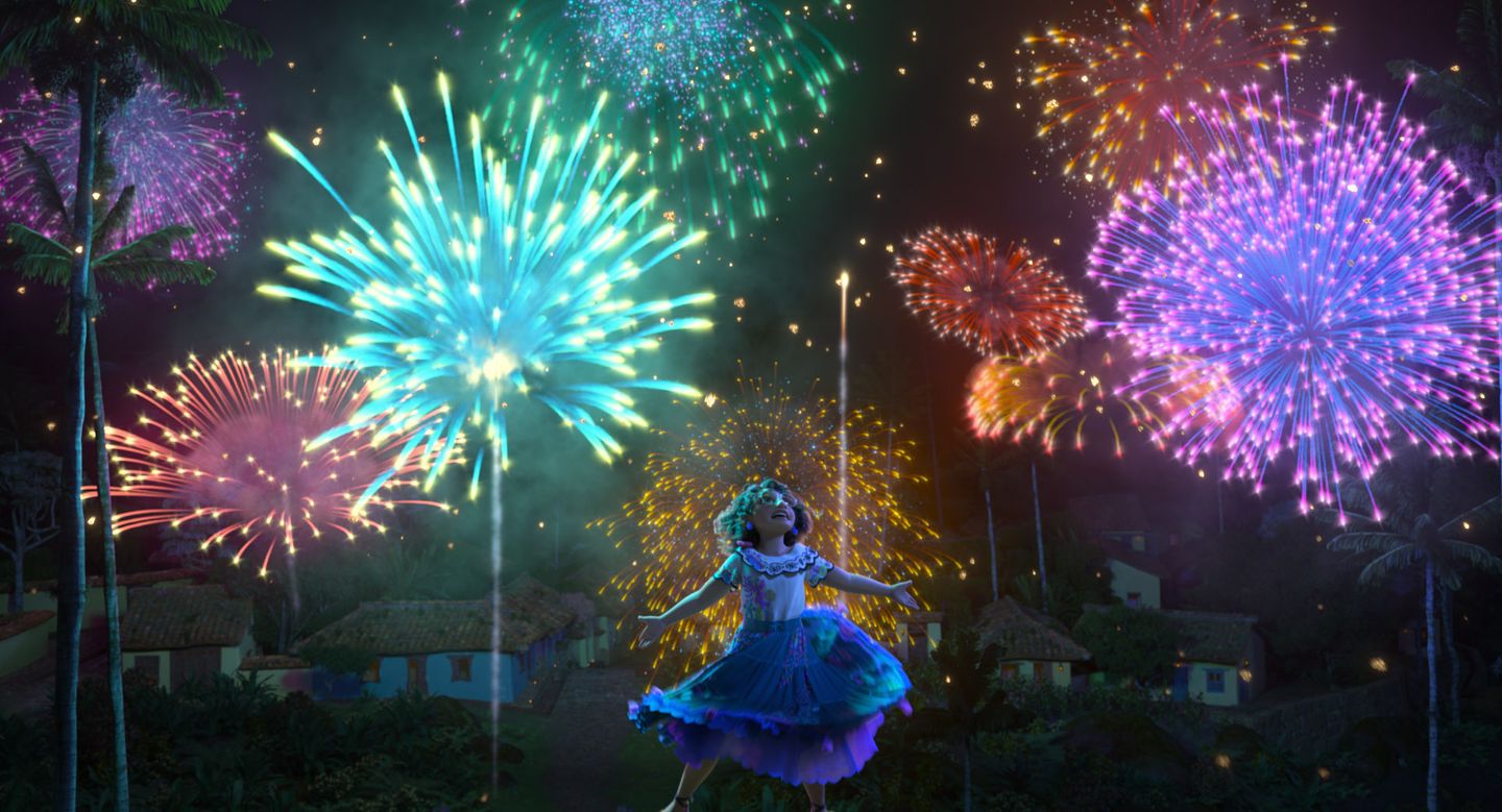 a person in a blue dress with fireworks in the background