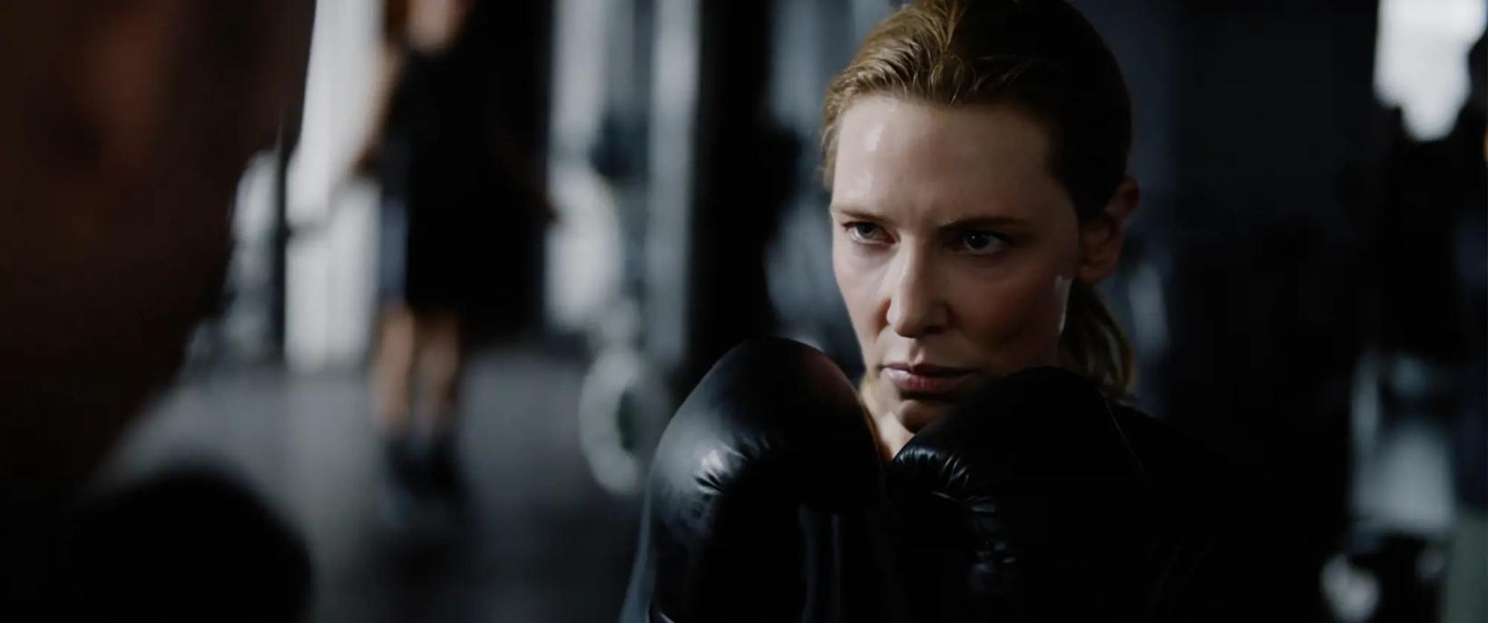 a woman with her hand on her chin
