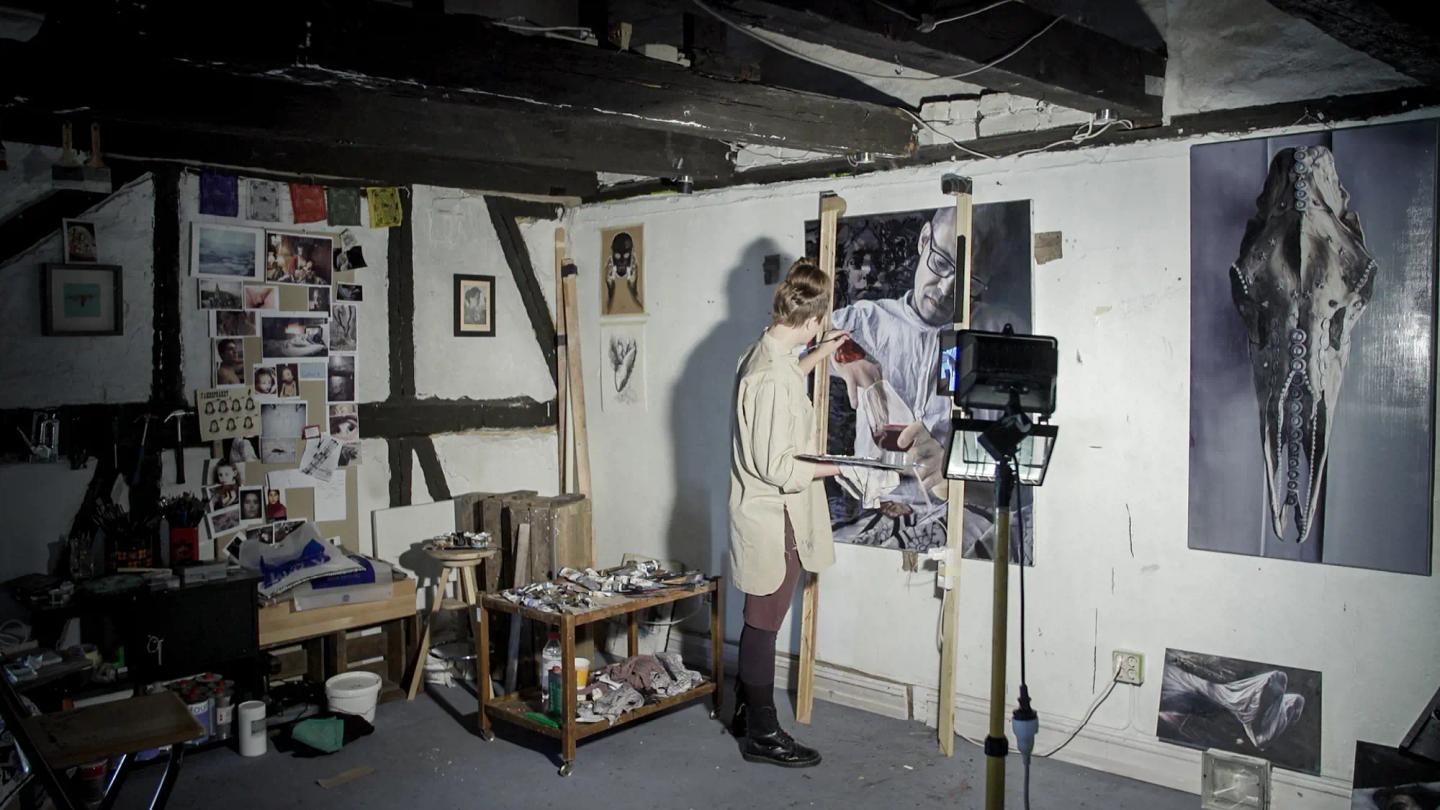 a person painting in a room
