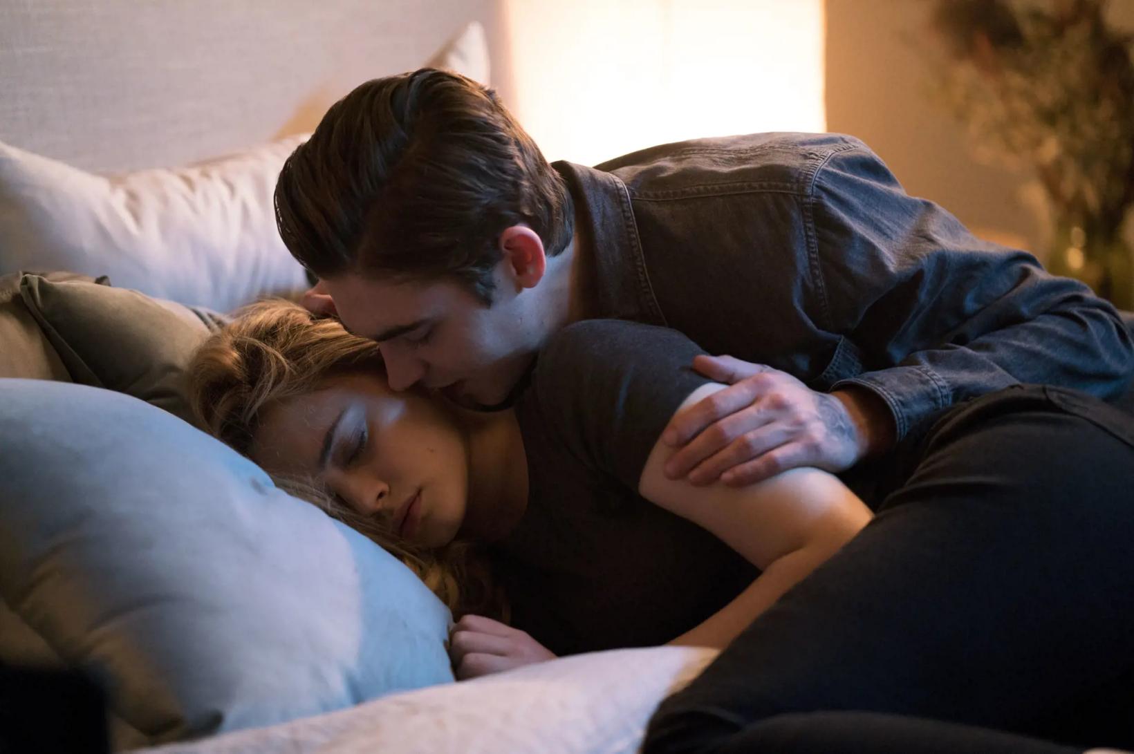 a man and woman lying on a couch