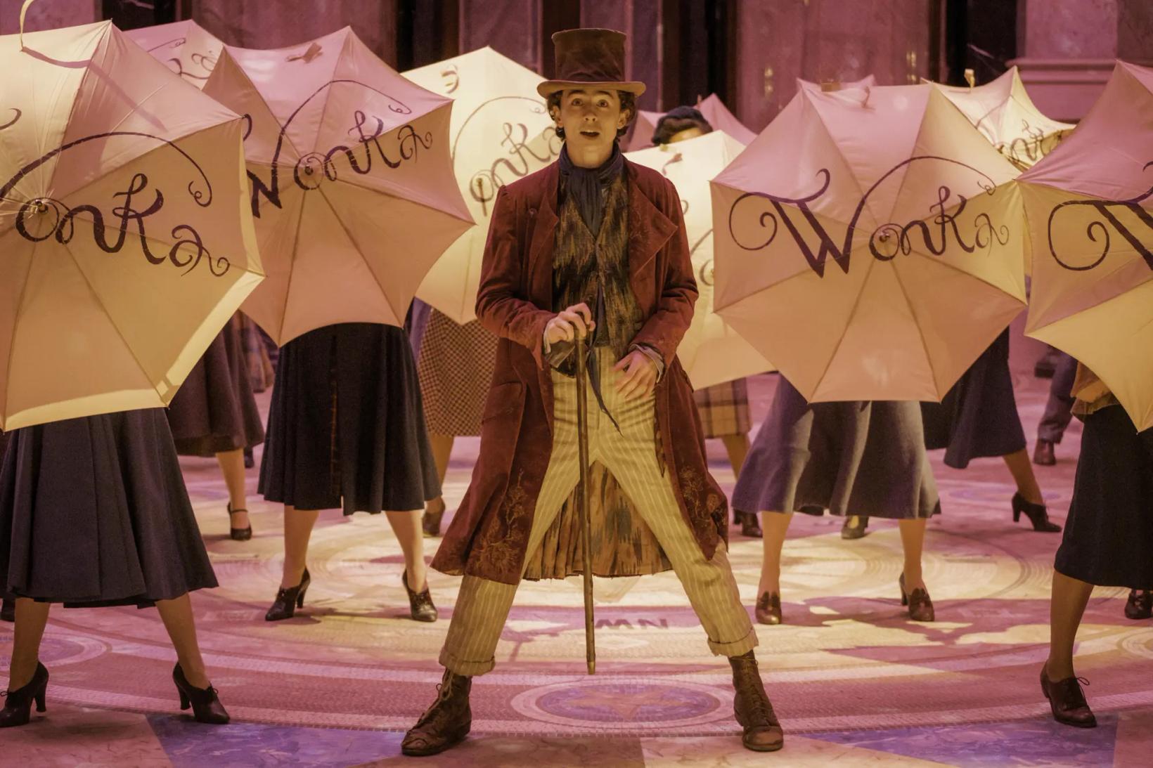 a person in a garment holding an umbrella