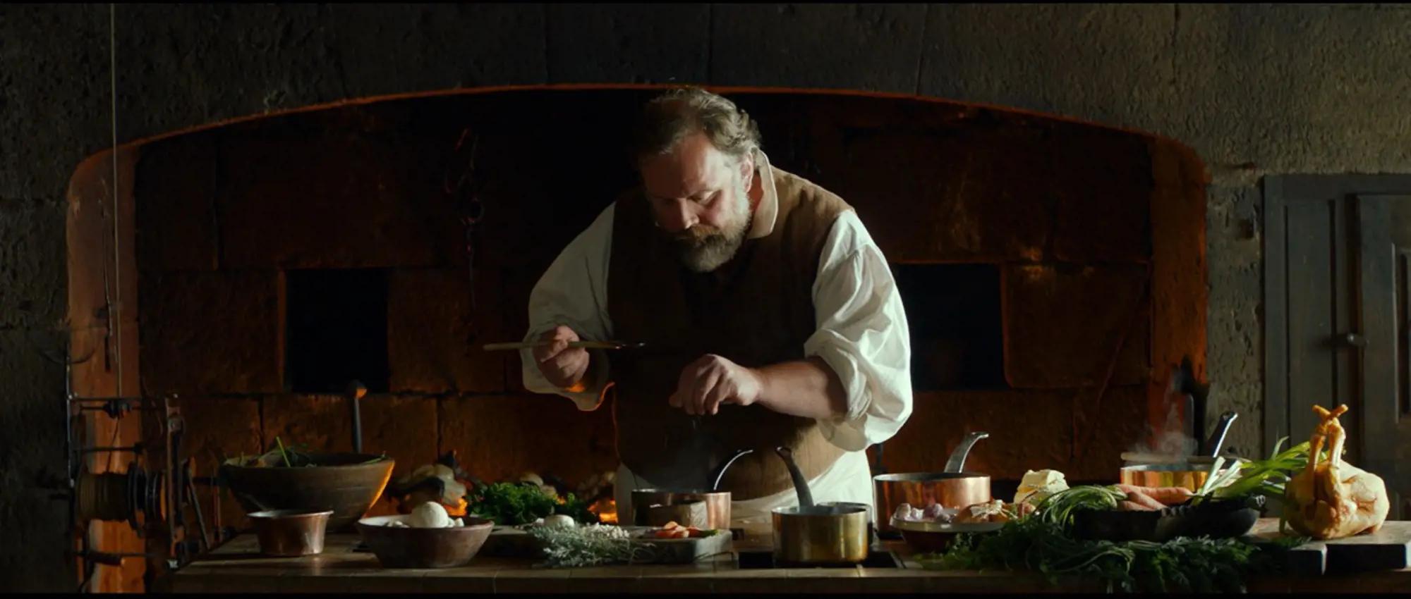 a man cooking in a kitchen