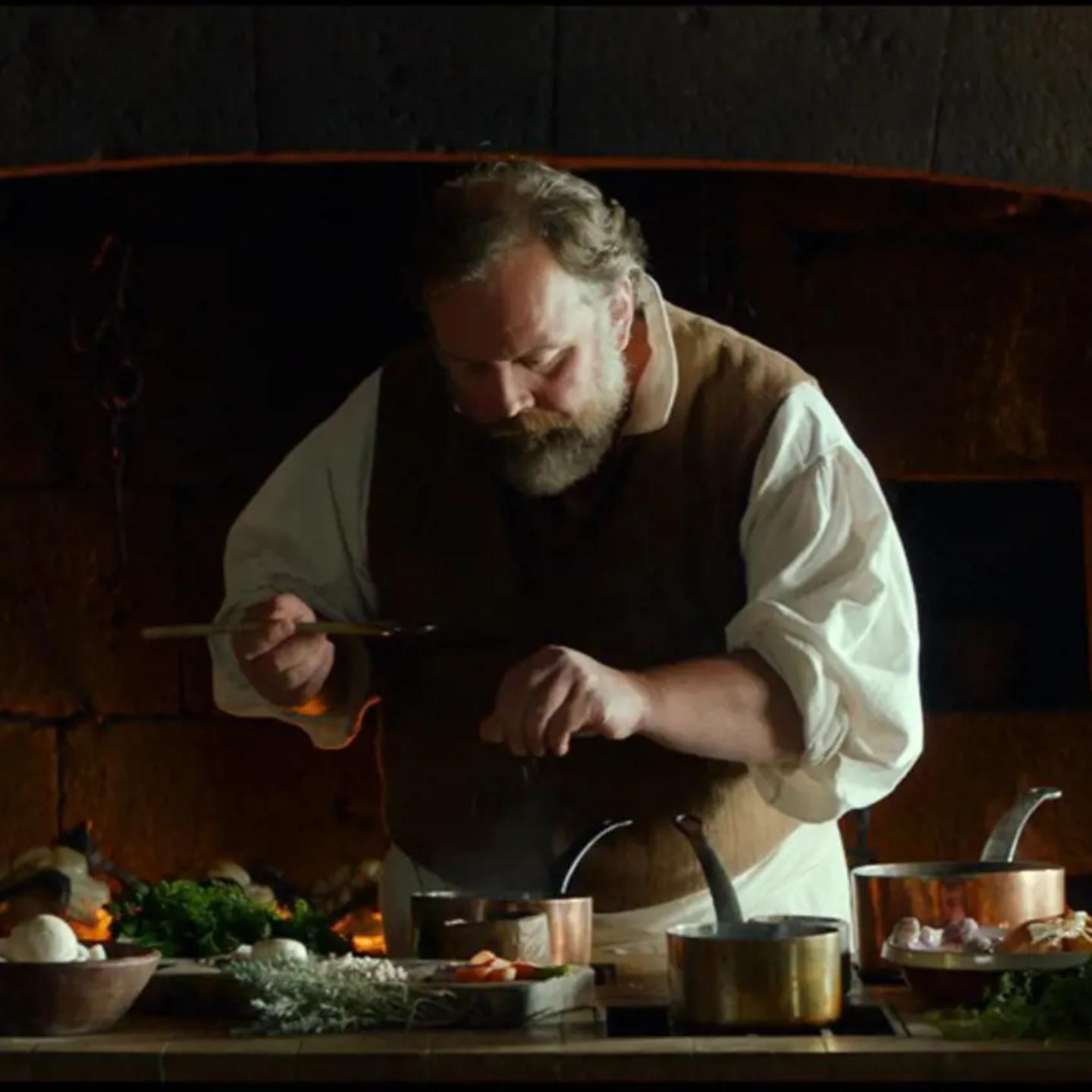 a man cooking in a kitchen
