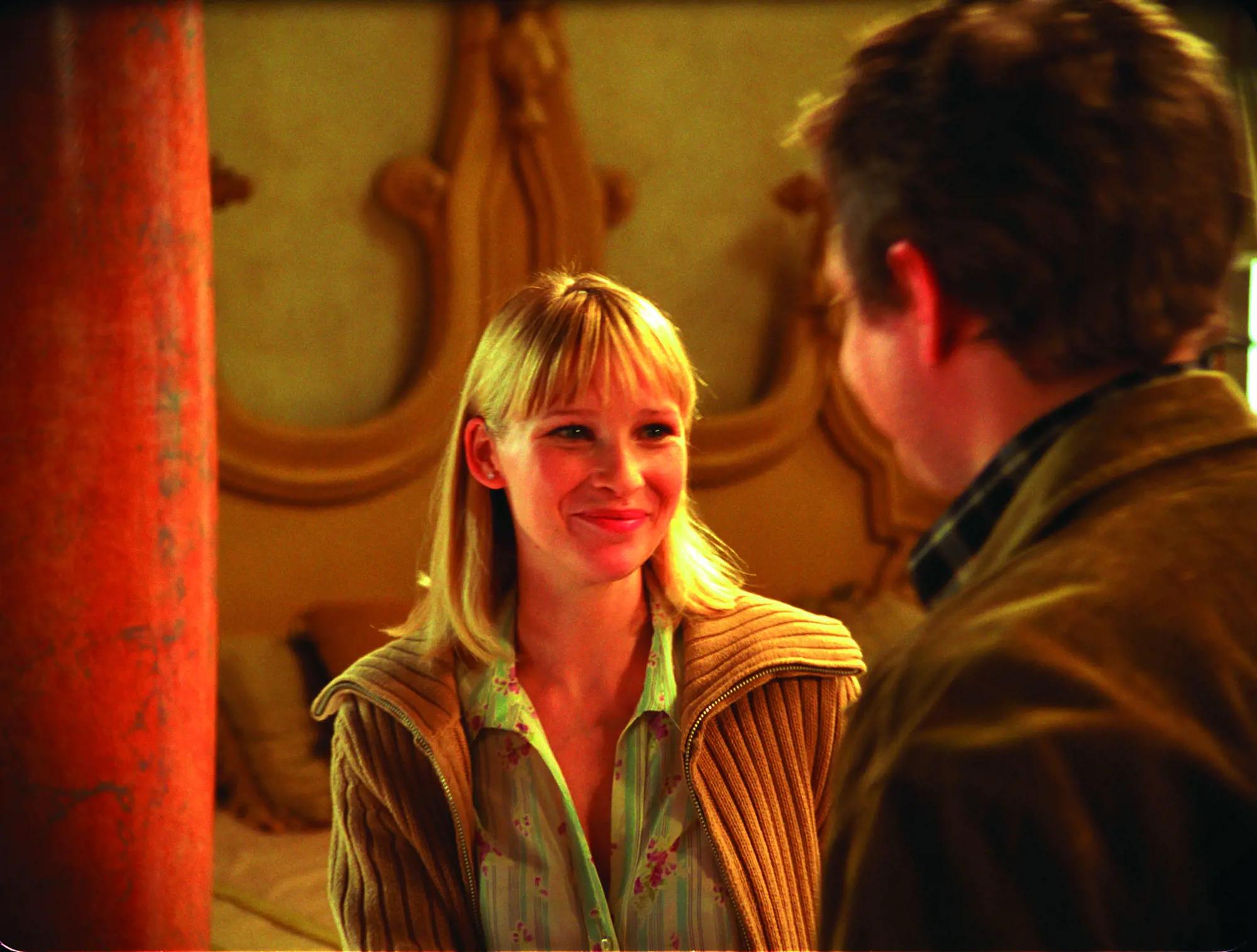 Joanna Page smiling at a man