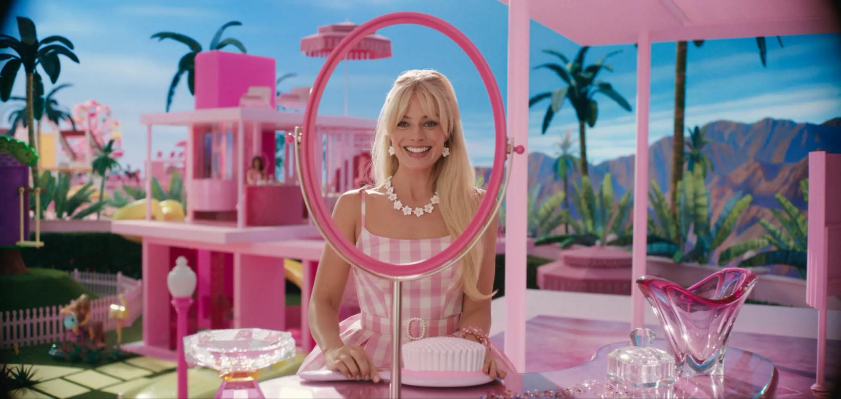 Margot Robbie sitting at a table