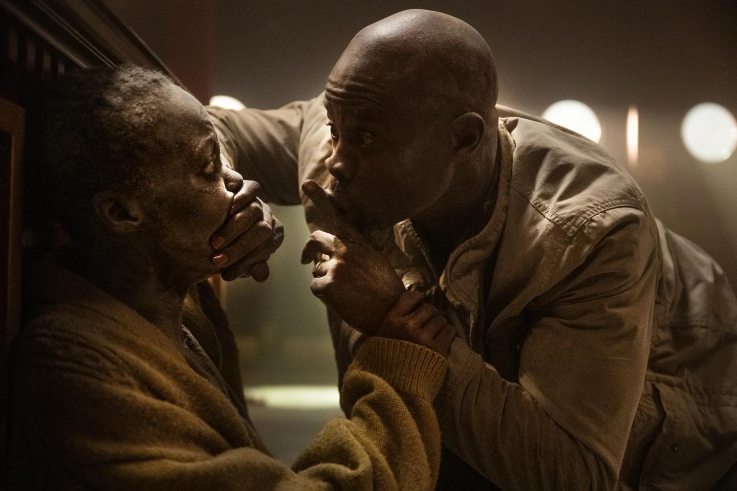 a man holding another man's face