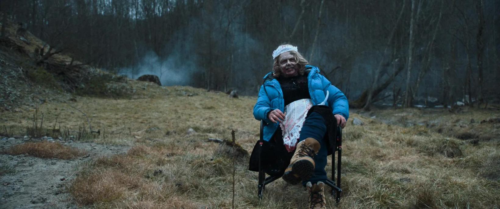 a person sitting in a chair outside