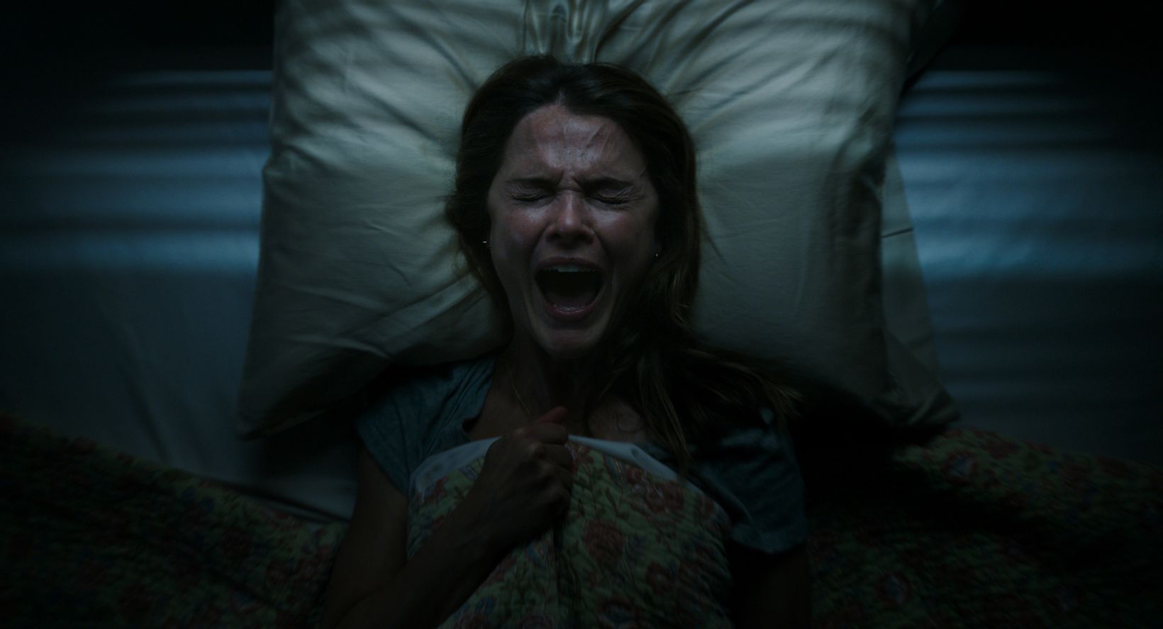 a person lying on a bed