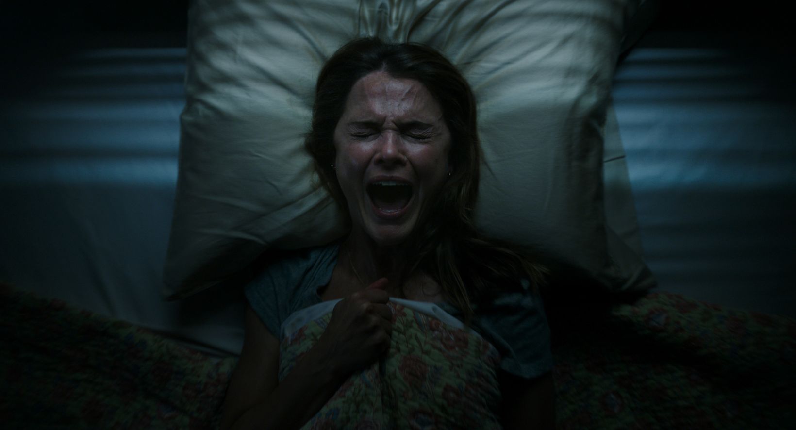 a person lying on a bed
