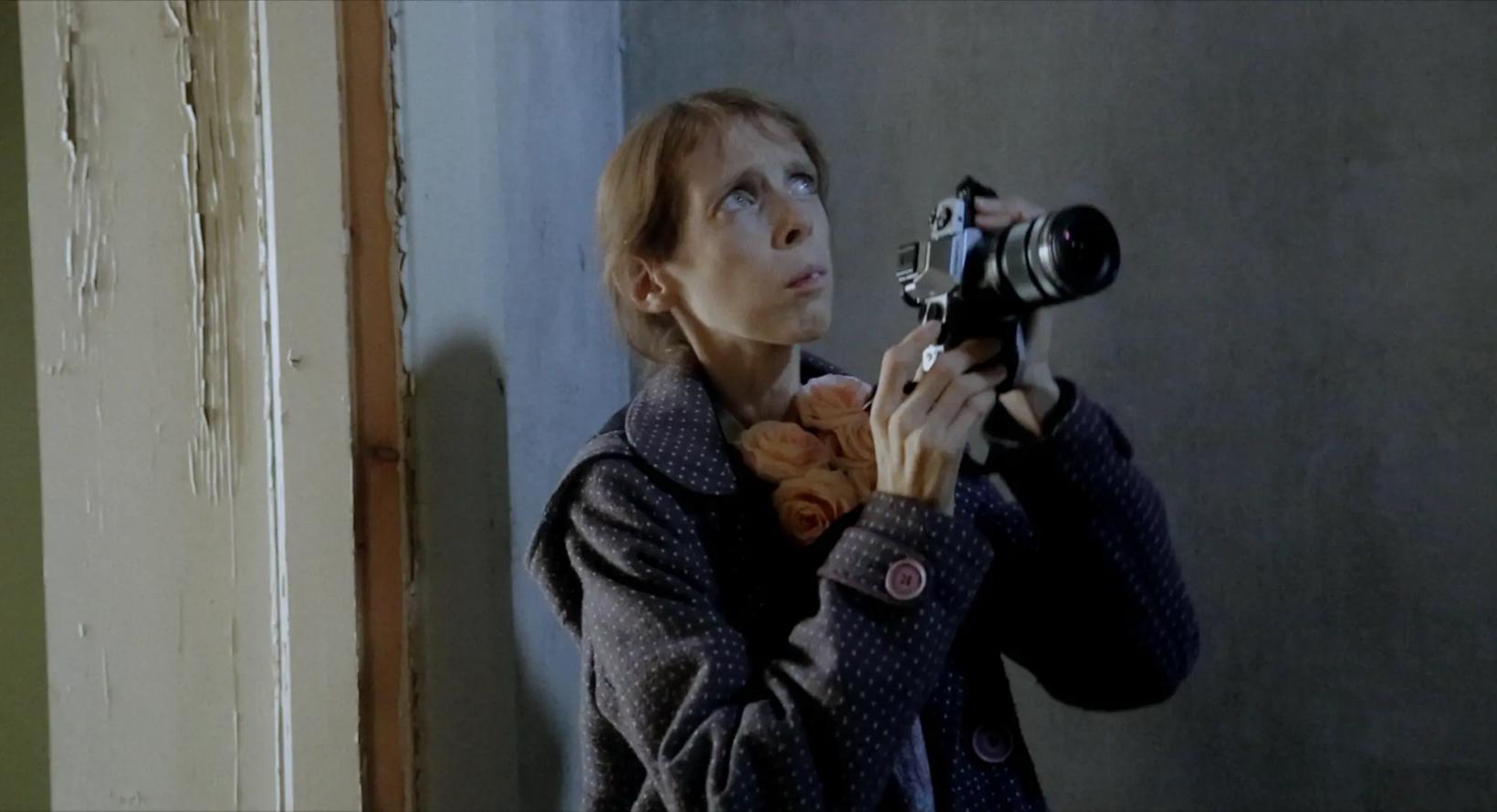 a person holding a camera