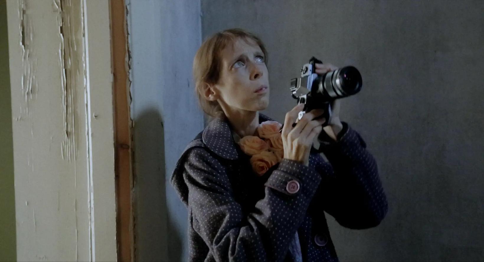 a person holding a camera