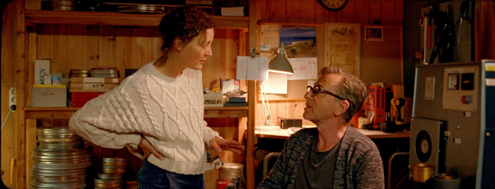 a woman and a man in a kitchen