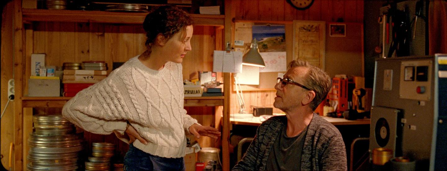a woman and a man in a kitchen