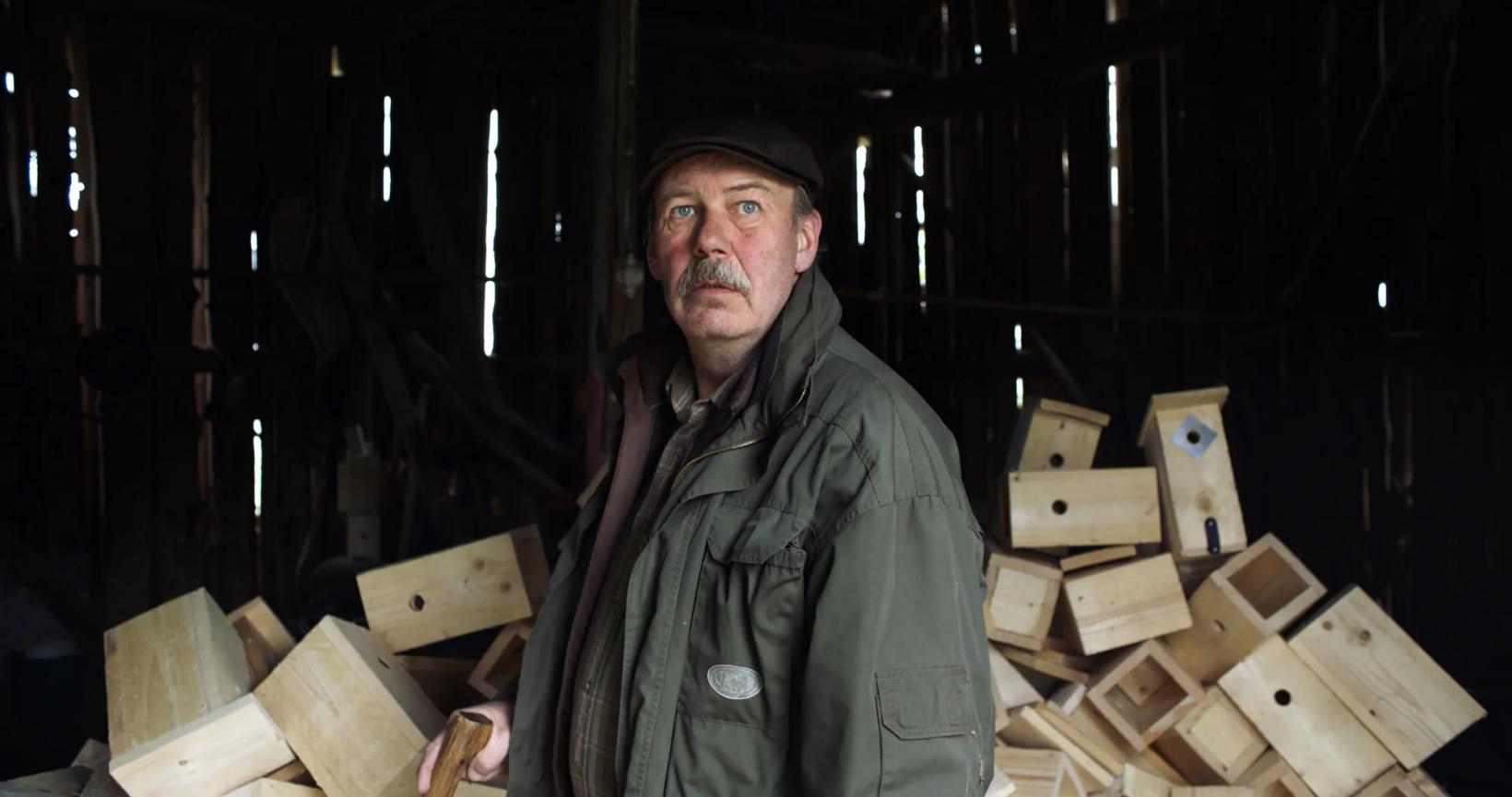 a person standing in a room with wood blocks