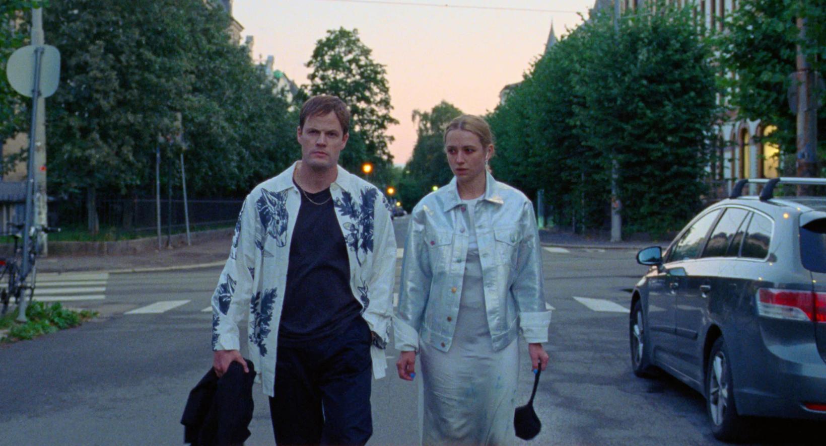 two men standing in a street