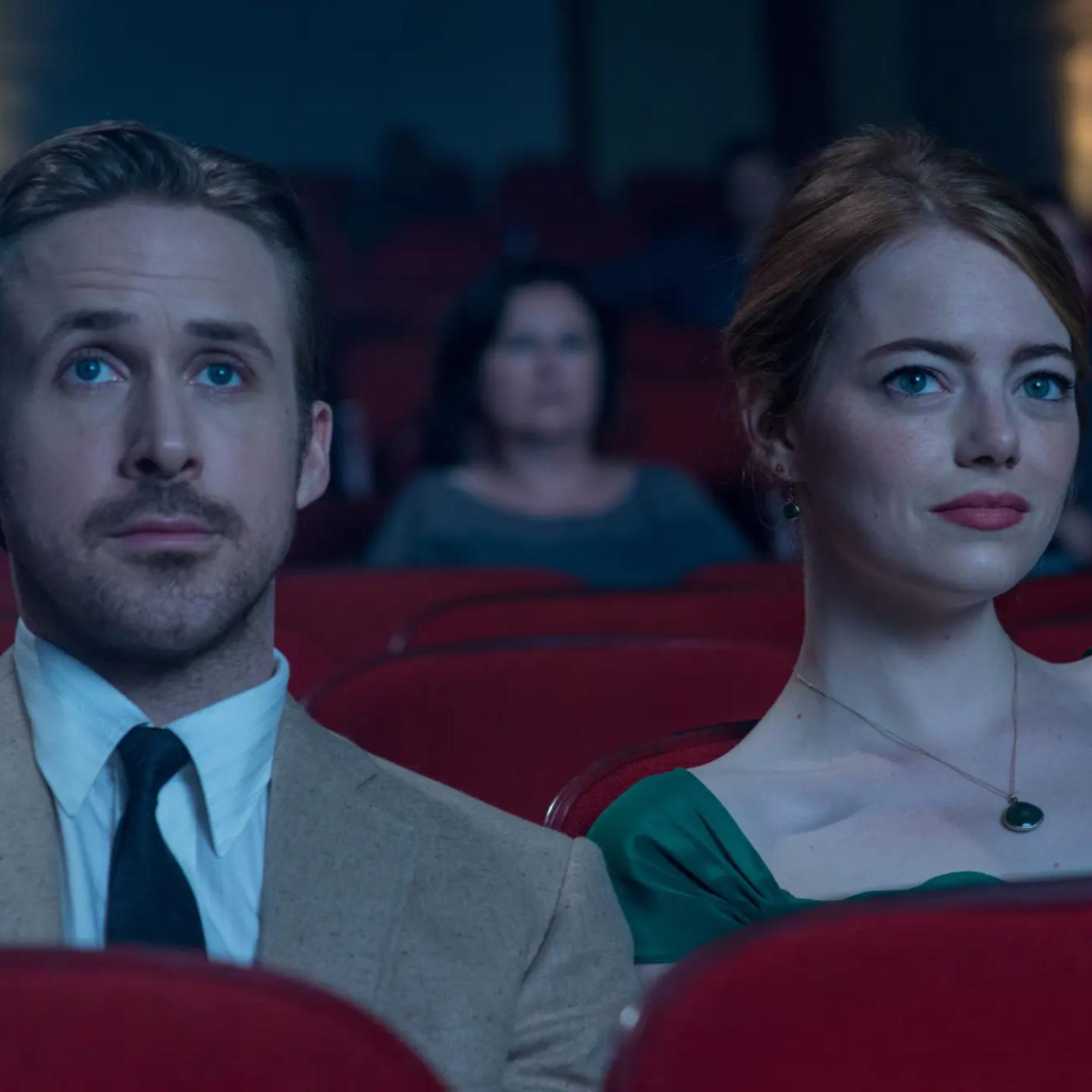 Ryan Gosling, Emma Stone et al. sitting in a theater