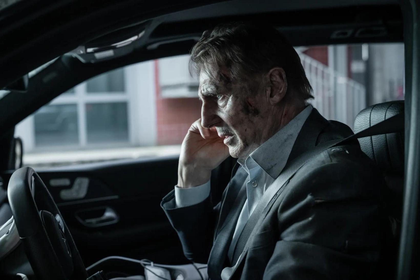 a man sitting in a car