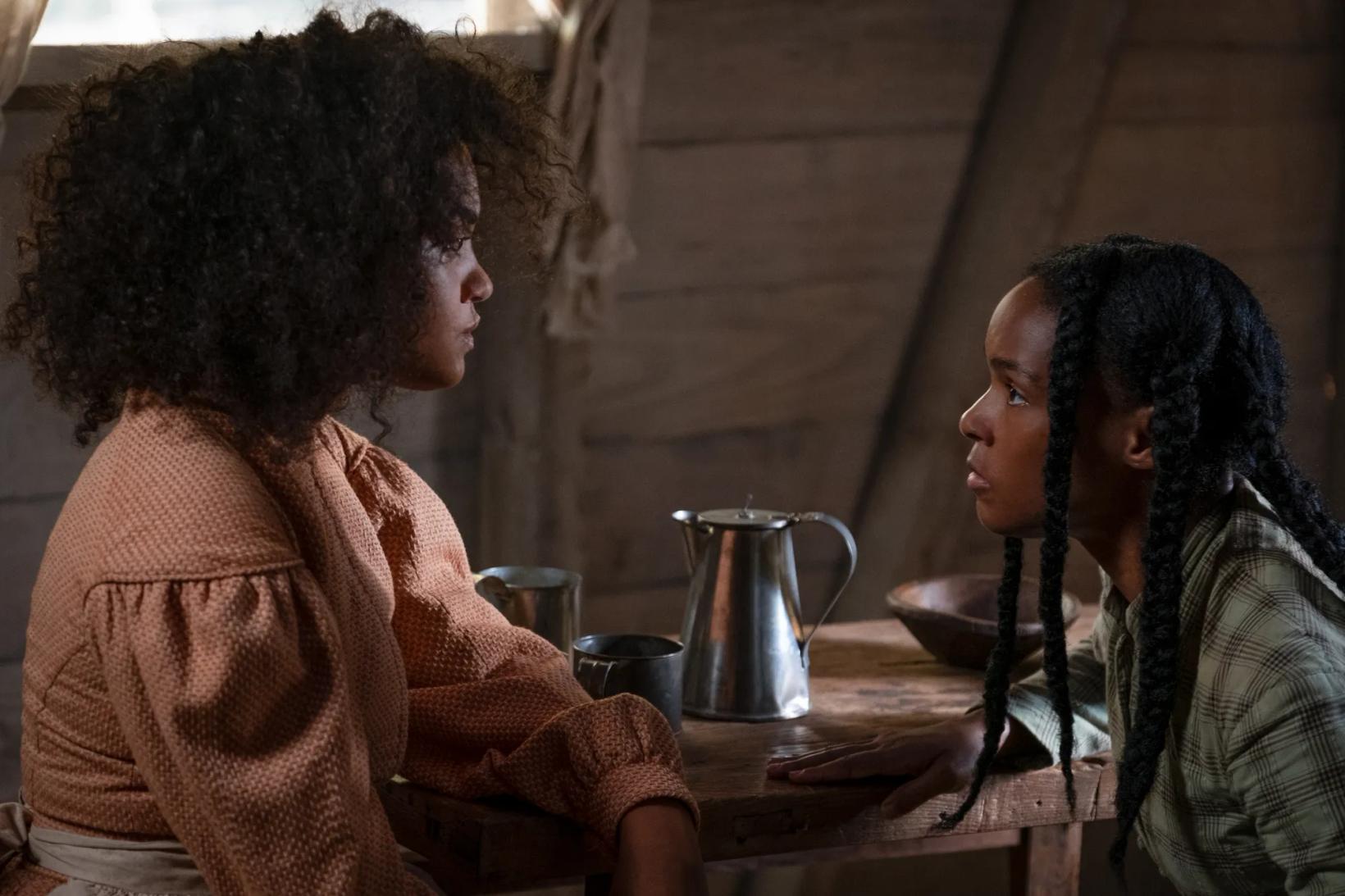 a woman and a man sitting at a table