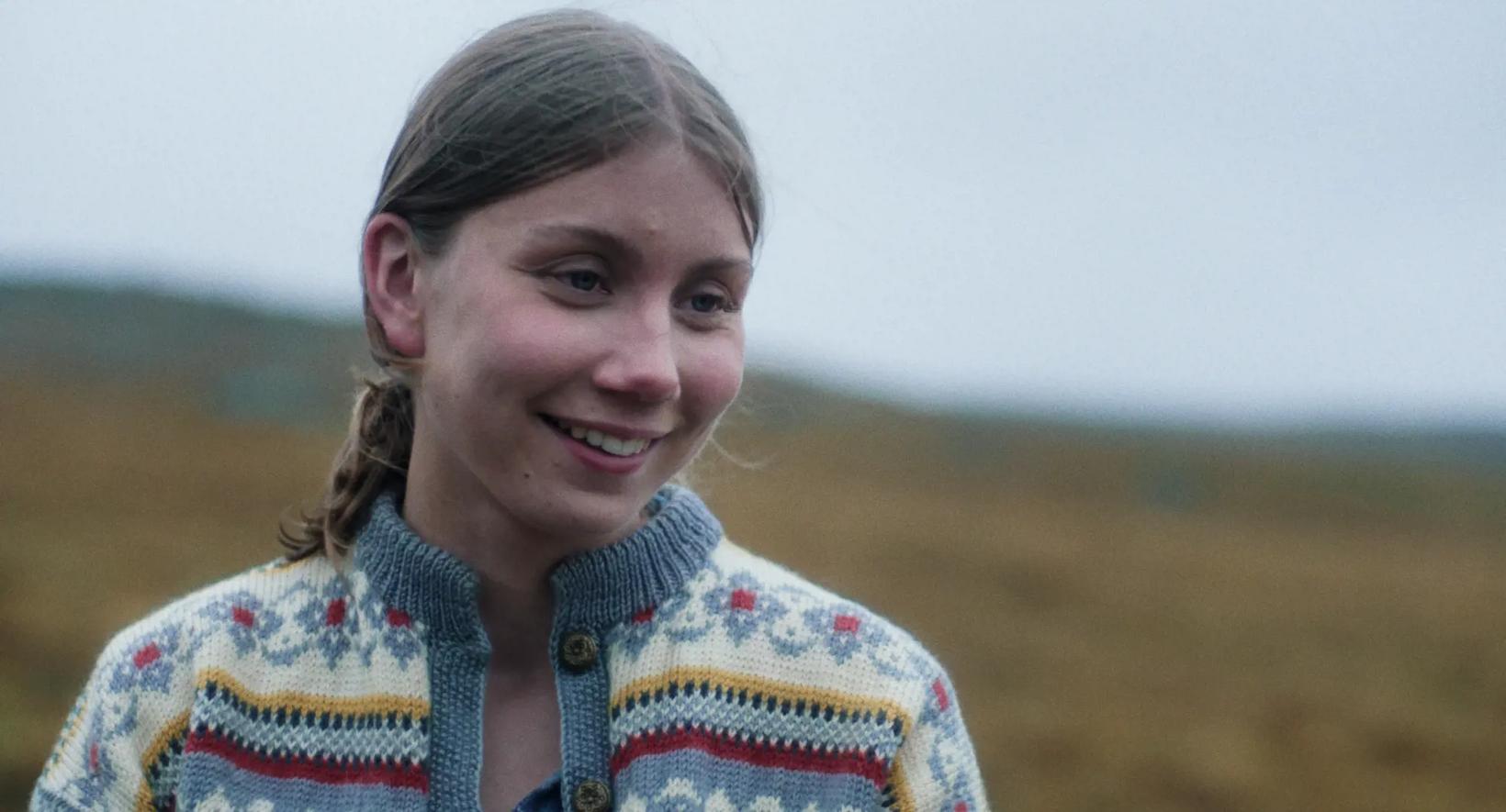 a person smiling at the camera
