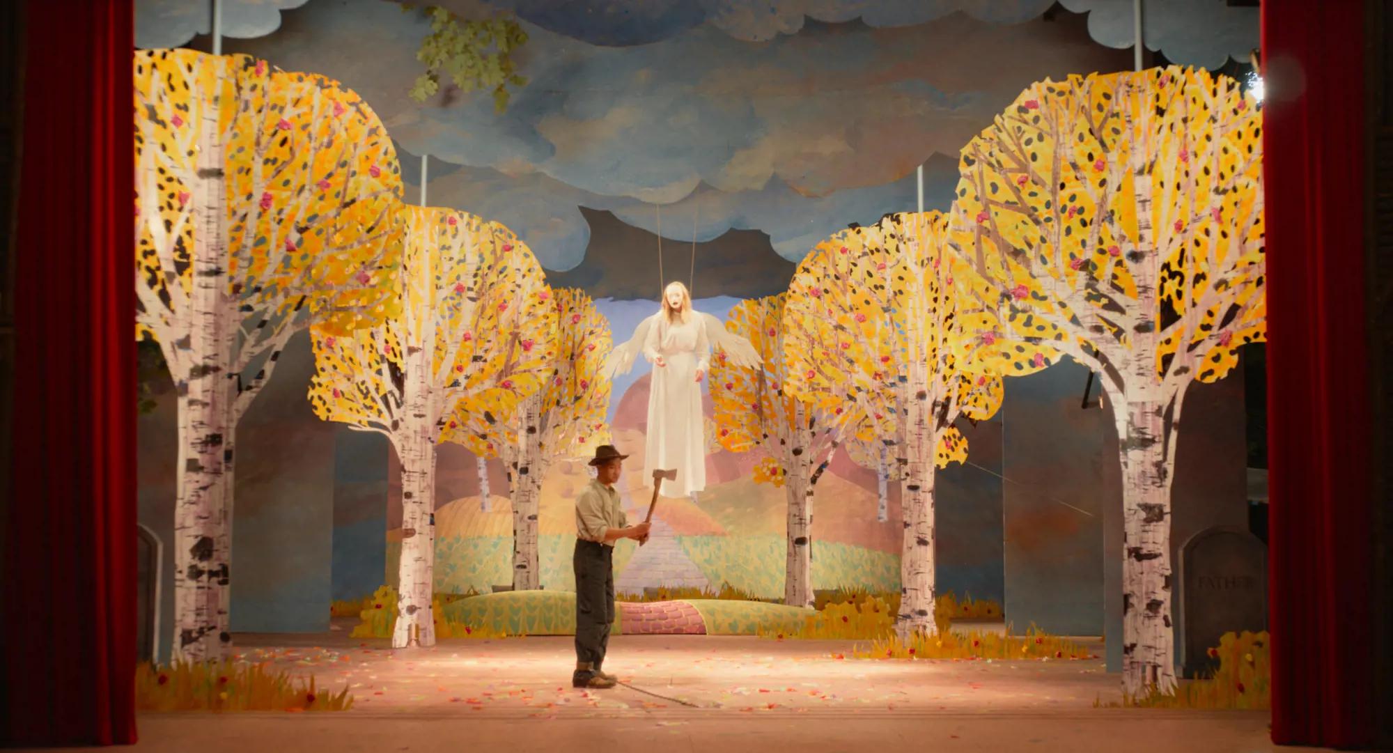 a person standing in front of a painting