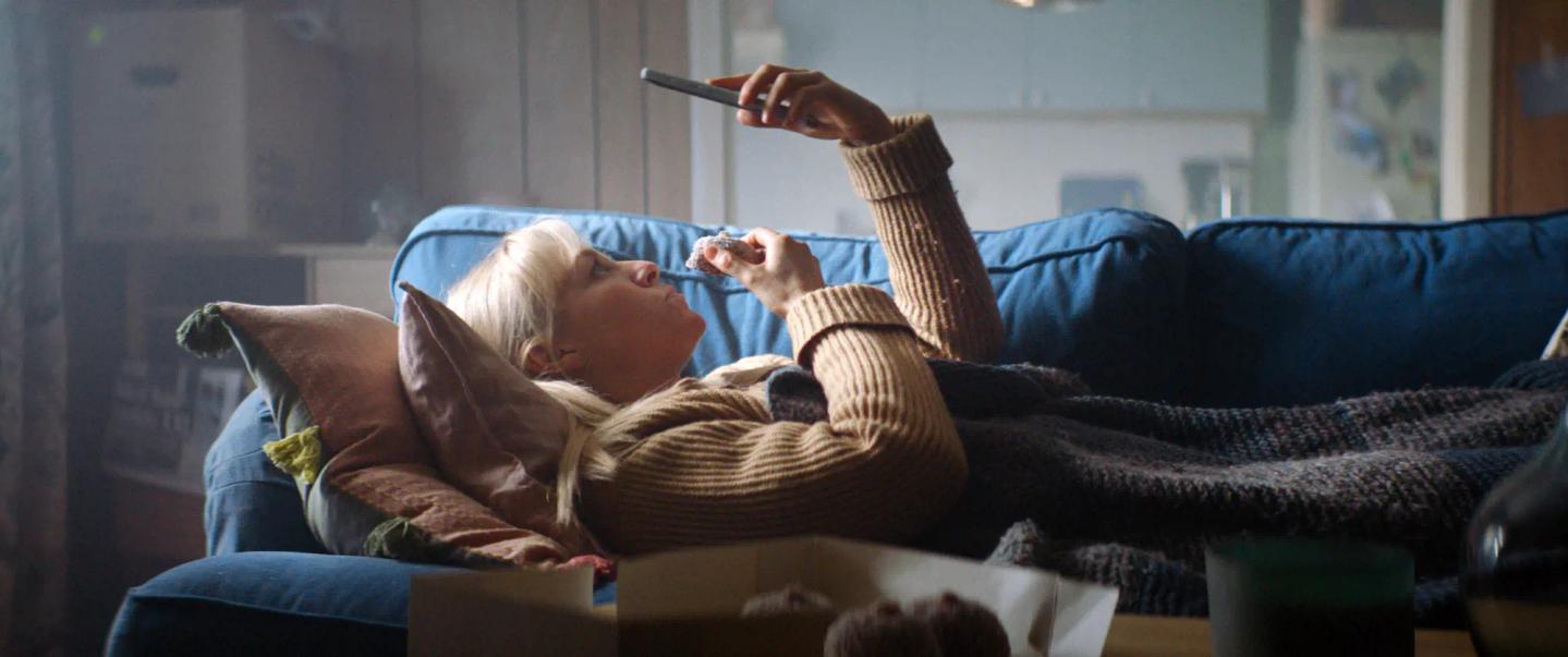 a person lying on a couch